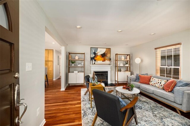 1928 Main St NW, Atlanta, GA 30318 - living area with a glass covered fireplace, wood finished floors, baseboards, and recessed lighting