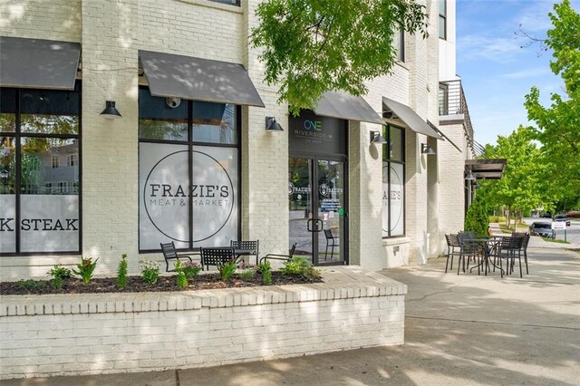 1928 Main St NW, Atlanta, GA 30318 - property entrance featuring brick siding and outdoor dining area