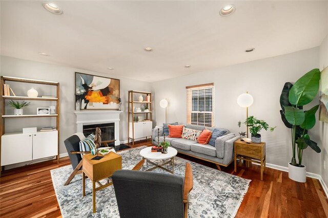 1928 Main St NW, Atlanta, GA 30318 - living area with wood finished floors, a glass covered fireplace, baseboards, and recessed lighting