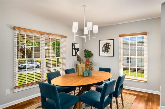 1928 Main St NW, Atlanta, GA 30318 - dining room featuring a chandelier, baseboards, and wood finished floors