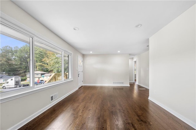 empty room featuring dark hardwood / wood-style floors