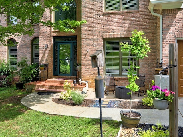 5105 Tynewick Trce NE, Roswell, GA 30075 - doorway to property with brick siding and a patio area