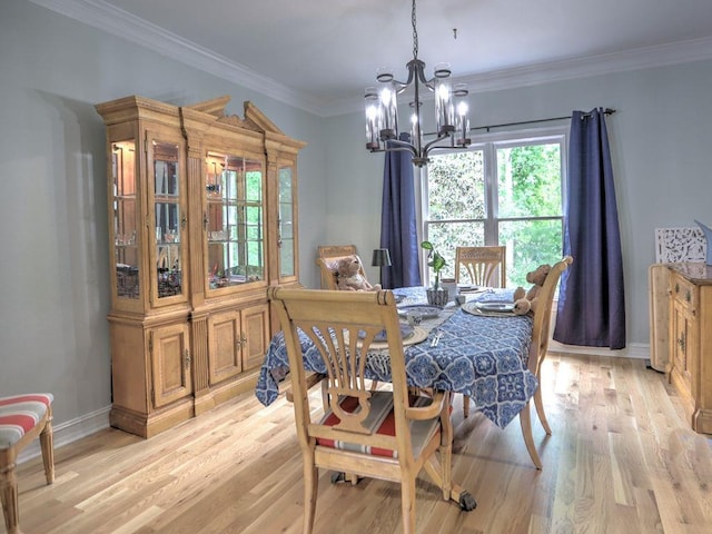 5105 Tynewick Trce NE, Roswell, GA 30075 - dining room featuring a chandelier, light wood finished floors, baseboards, and crown molding