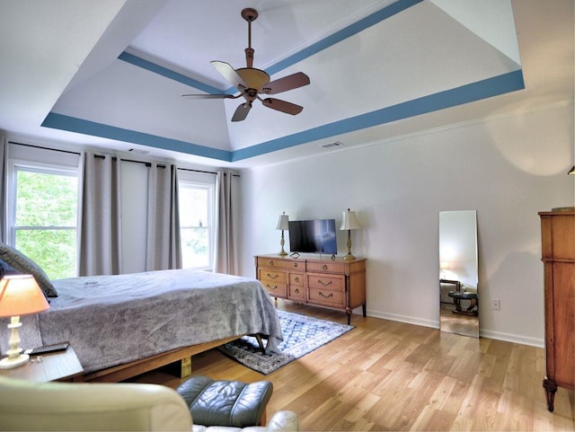 5105 Tynewick Trce NE, Roswell, GA 30075 - bedroom featuring a raised ceiling, light wood finished floors, and baseboards