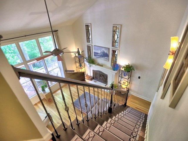 5105 Tynewick Trce NE, Roswell, GA 30075 - stairway with wood finished floors, healthy amount of natural light, baseboards, a fireplace, and vaulted ceiling