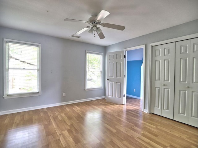 5105 Tynewick Trce NE, Roswell, GA 30075 - unfurnished bedroom featuring light wood-style floors, baseboards, and a ceiling fan