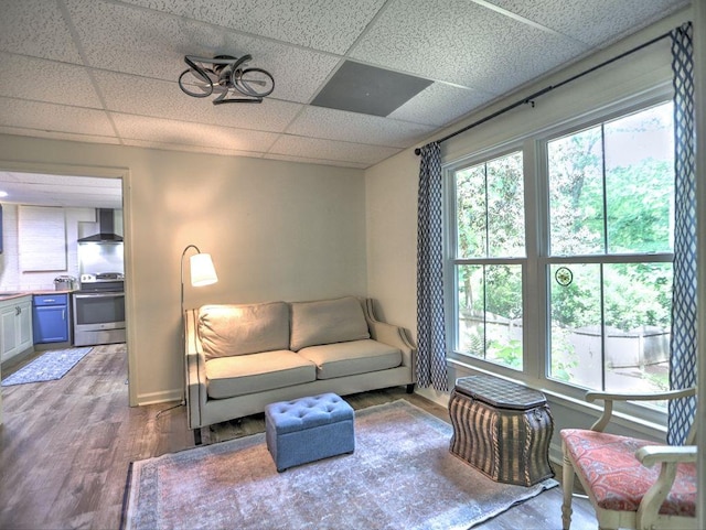 5105 Tynewick Trce NE, Roswell, GA 30075 - living room featuring wood finished floors, a paneled ceiling, and baseboards