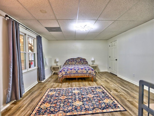 5105 Tynewick Trce NE, Roswell, GA 30075 - bedroom featuring wood finished floors, a drop ceiling, and baseboards