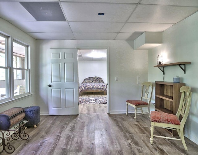 5105 Tynewick Trce NE, Roswell, GA 30075 - living area featuring a drop ceiling, wood finished floors, and baseboards