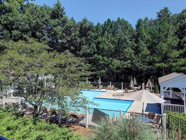 5105 Tynewick Trce NE, Roswell, GA 30075 - community pool featuring fence and a patio area