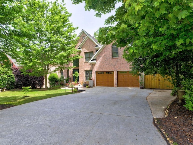 5105 Tynewick Trce NE, Roswell, GA 30075 - view of front of house featuring concrete driveway, an attached garage, a front lawn, and brick siding