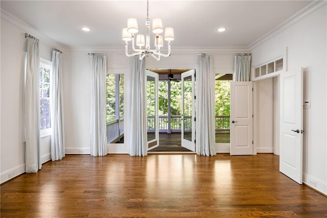 entryway with crown molding, wood finished floors, a chandelier, baseboards, and recessed lighting