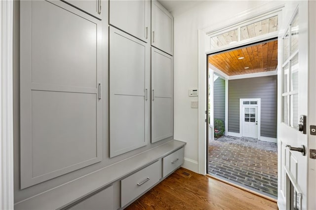 mudroom featuring wood ceiling, baseboards, and dark wood finished floors