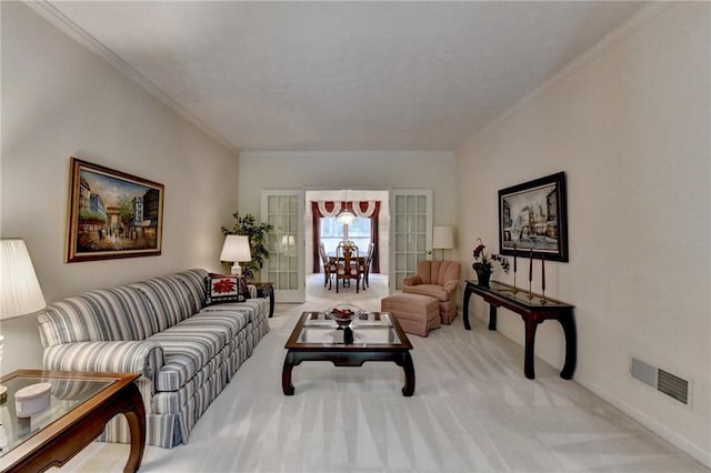 living room featuring crown molding, baseboards, visible vents, and carpet