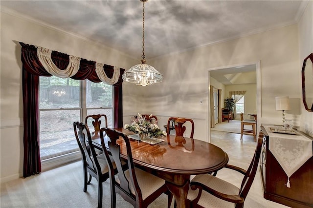 dining room featuring an inviting chandelier and crown molding