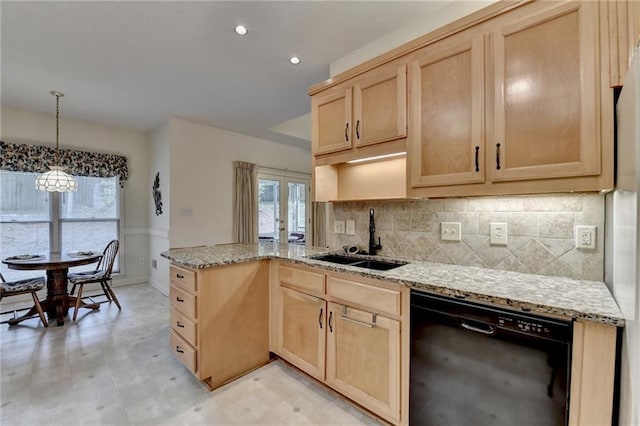 kitchen with a peninsula, light brown cabinets, tasteful backsplash, a sink, and dishwasher