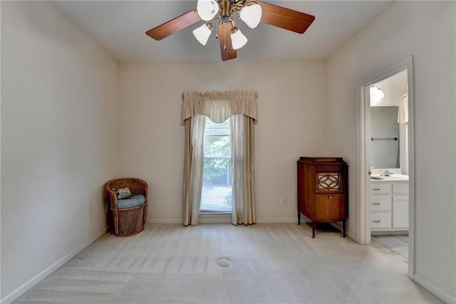 bedroom featuring ensuite bathroom, a sink, carpet, and baseboards
