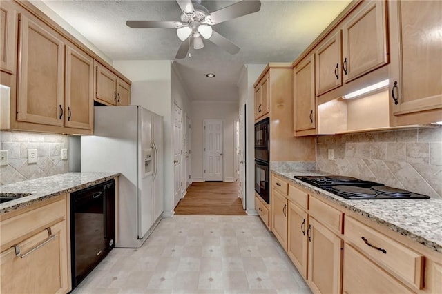 kitchen with ceiling fan, light stone countertops, black appliances, light floors, and light brown cabinets