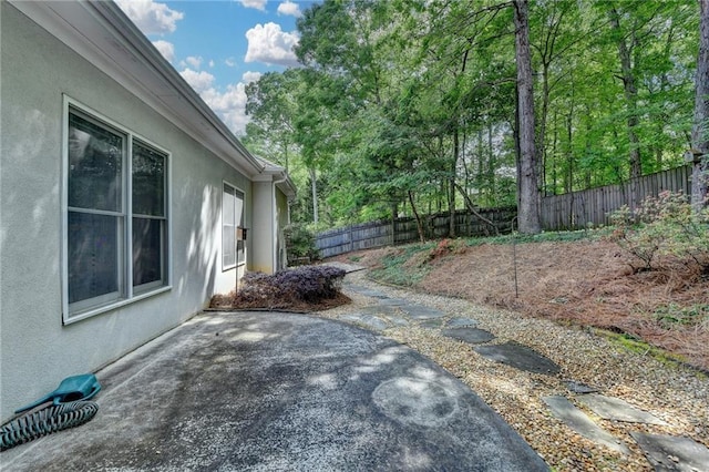 view of yard with a fenced backyard and a patio area
