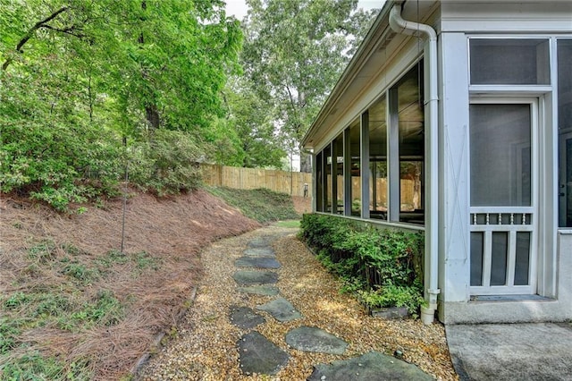 view of side of property with fence