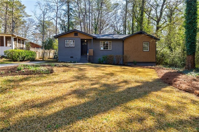 view of front of home featuring crawl space, a front yard, and fence