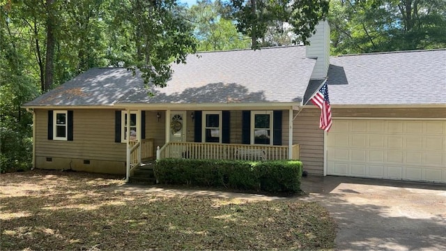 1751 Bridle Ln, Macon, GA 31220 - view of front facade with an attached garage, a porch, concrete driveway, a chimney, and crawl space