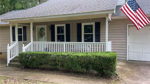 1751 Bridle Ln, Macon, GA 31220 - doorway to property featuring a garage, roof with shingles, and covered porch