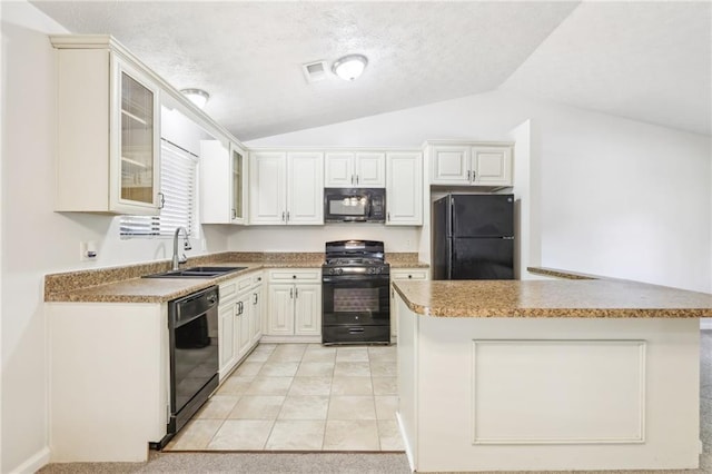 kitchen with white cabinetry, black appliances, vaulted ceiling, and light colored carpet