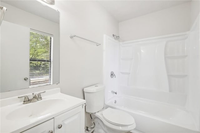 full bathroom featuring a wealth of natural light, vanity, shower / washtub combination, and toilet