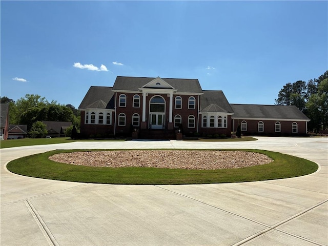 neoclassical / greek revival house with curved driveway