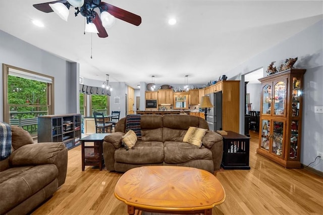 1731 Apple Pie Ridge Rd, Alto, GA 30510 - living room with ceiling fan, light wood-style floors, a chandelier, and baseboards