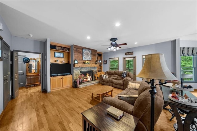 1731 Apple Pie Ridge Rd, Alto, GA 30510 - living area featuring light wood-style flooring, ceiling fan, a stone fireplace, and recessed lighting