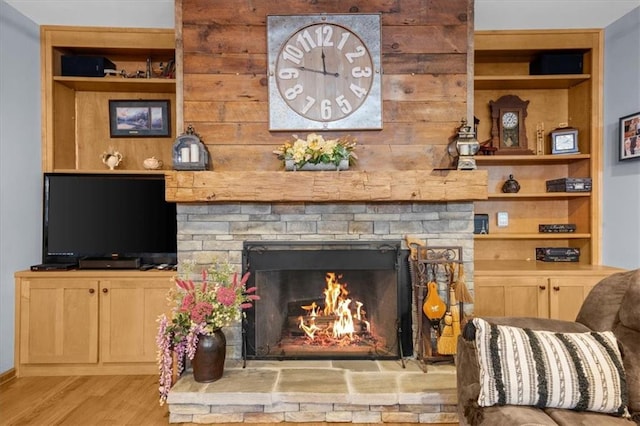 1731 Apple Pie Ridge Rd, Alto, GA 30510 - living room with a stone fireplace, light wood-style flooring, and built in features