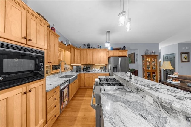 1731 Apple Pie Ridge Rd, Alto, GA 30510 - kitchen with appliances with stainless steel finishes, a sink, light wood-style flooring, and light stone countertops