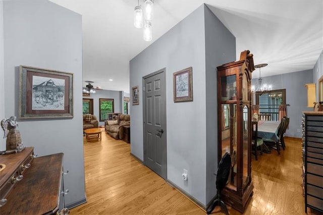 1731 Apple Pie Ridge Rd, Alto, GA 30510 - corridor featuring light wood-style flooring and a chandelier