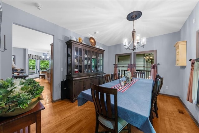 1731 Apple Pie Ridge Rd, Alto, GA 30510 - dining area featuring a chandelier and light wood-style flooring