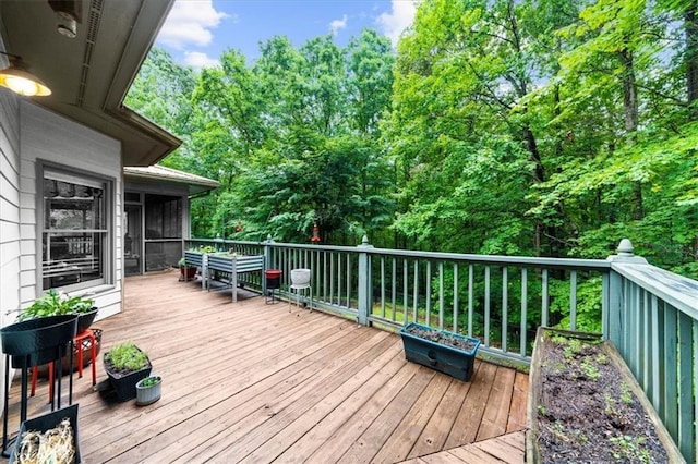 1731 Apple Pie Ridge Rd, Alto, GA 30510 - wooden deck featuring a sunroom and view of wooded area