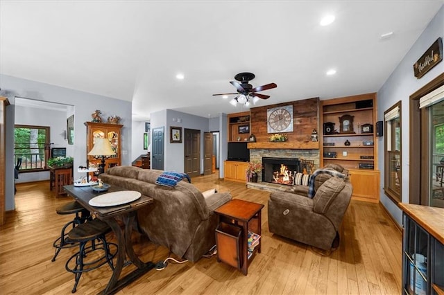 1731 Apple Pie Ridge Rd, Alto, GA 30510 - living room with light wood-type flooring, a ceiling fan, a fireplace, recessed lighting, and built in features