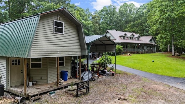 1731 Apple Pie Ridge Rd, Alto, GA 30510 - back of property featuring a gambrel roof, a yard, metal roof, view of scattered trees, and a detached carport