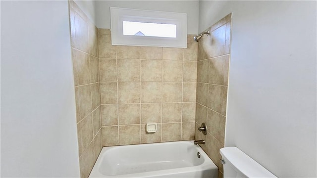 bathroom with tub / shower combination and toilet