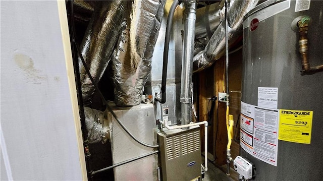 utility room with heating unit and water heater