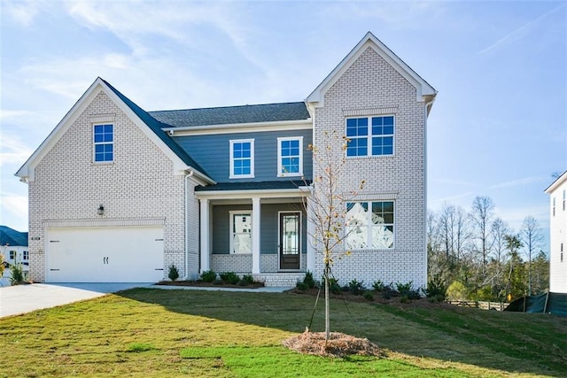 view of front of house featuring a porch, a garage, and a front lawn