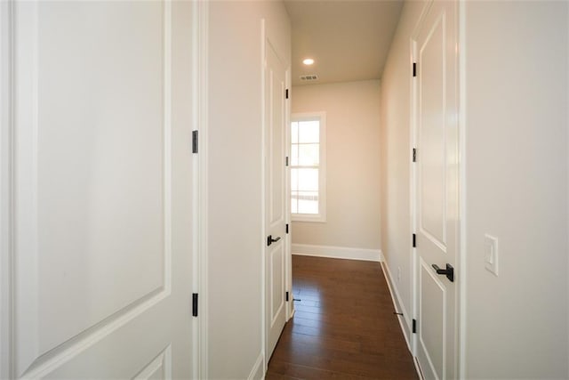 hall with dark hardwood / wood-style flooring