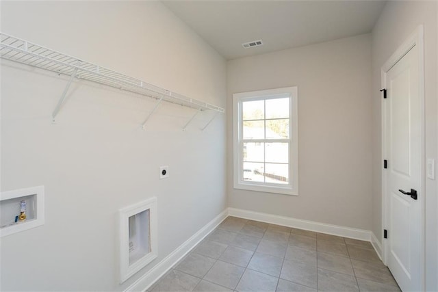 laundry room featuring hookup for a washing machine, electric dryer hookup, and light tile patterned flooring