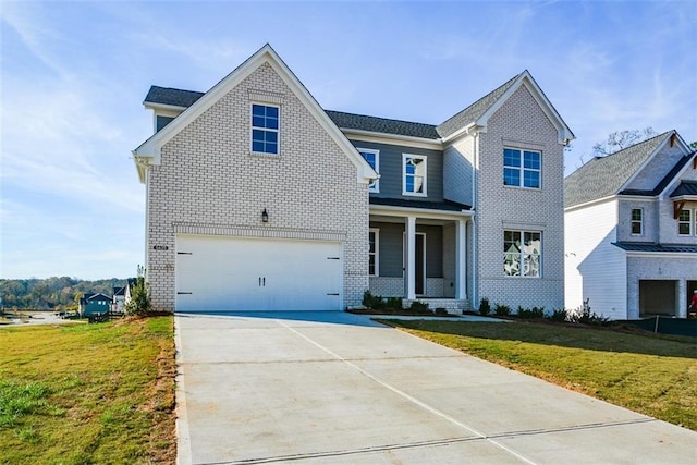 view of front of property with covered porch, a front yard, and a garage