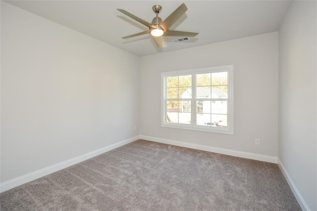 unfurnished room with ceiling fan and light carpet