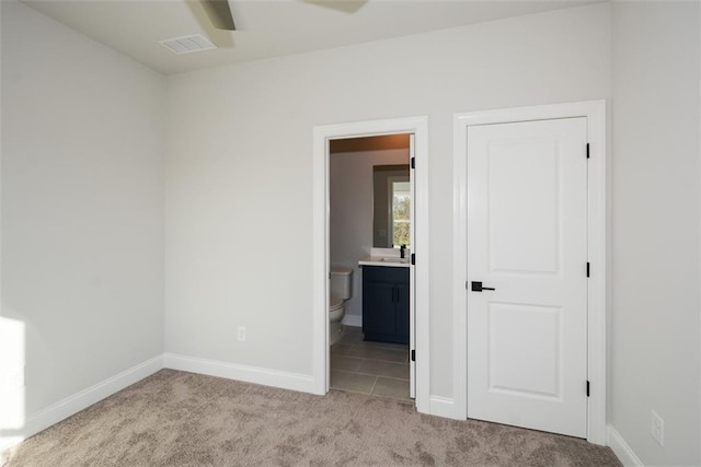 carpeted empty room with sink