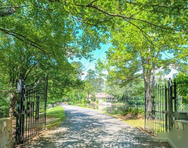 view of gate with a water view