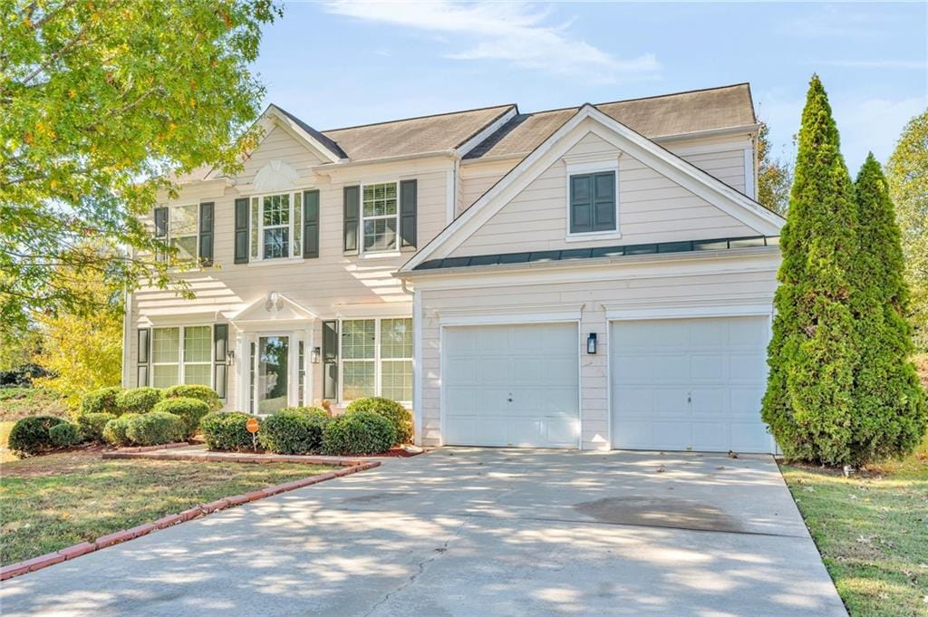 view of front of property with a garage