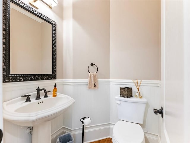 bathroom featuring sink and toilet